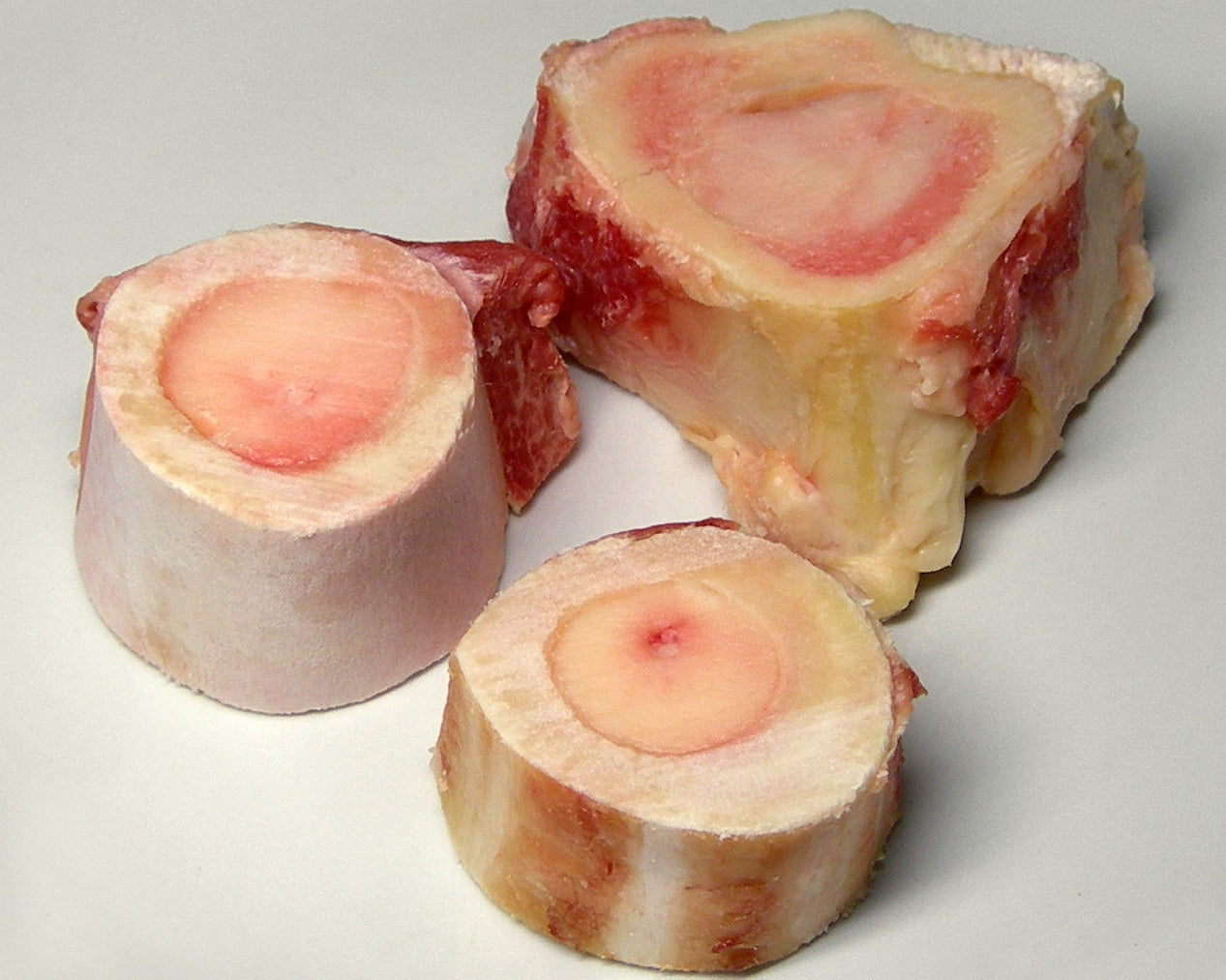 Bone marrow bones: three cross-section marrow bones with exposed pink marrow