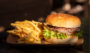 Ground pork burger with lettuce and tomato, served with fries